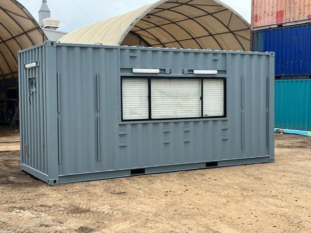 Modified shipping container site office with window